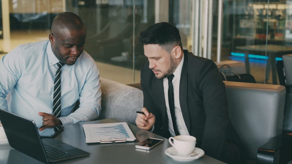 Business owner reviewing restructured MCA payment plan with financial advisor