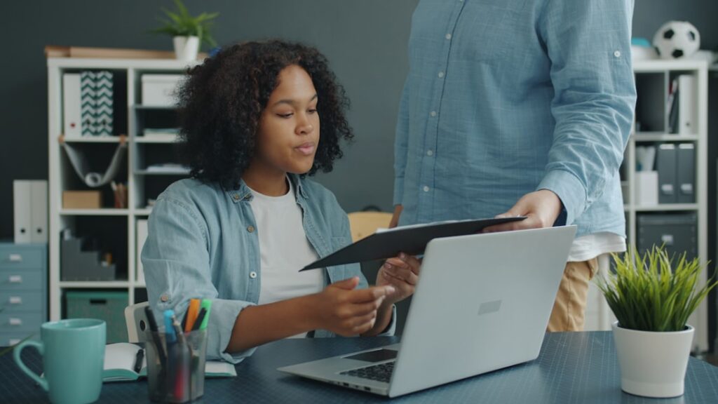 Bank loan officer reviewing a small business loan application with documents