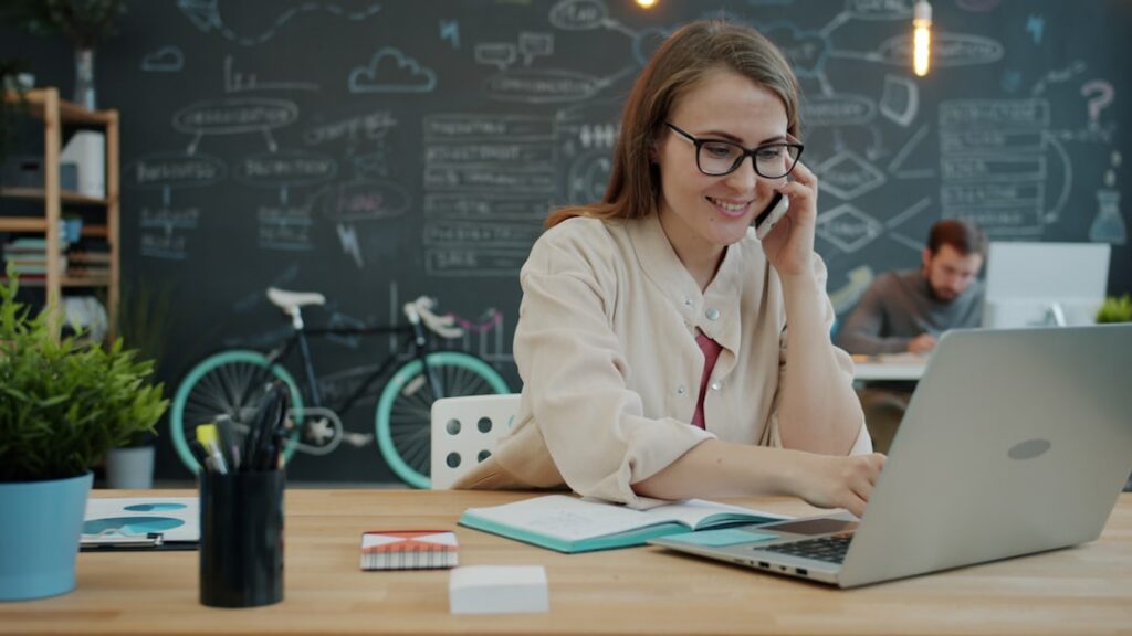 Small business owner calling an MCA options specialist to discuss Q3 debt relief options