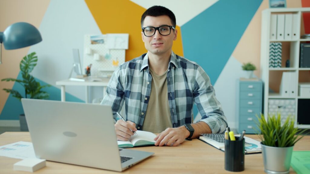 Business owner analyzing financial warning signs in mid-year spreadsheet with monthly cash flow data
