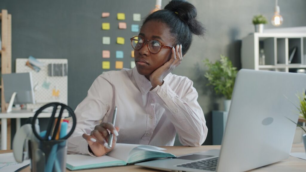 Small business owner reviewing Q3 cash flow projections against MCA payments