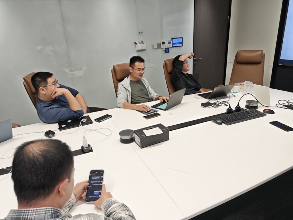 Professional MCA settlement negotiation meeting between business owner and funder representative