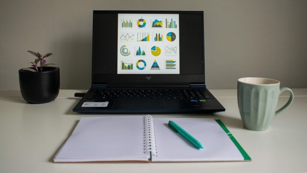 Cash flow spreadsheet on a laptop with a calculator and financial documents on a business desk