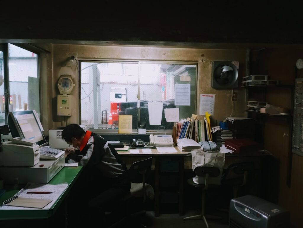 Small business franchise owner reviewing multiple payment obligations and invoices