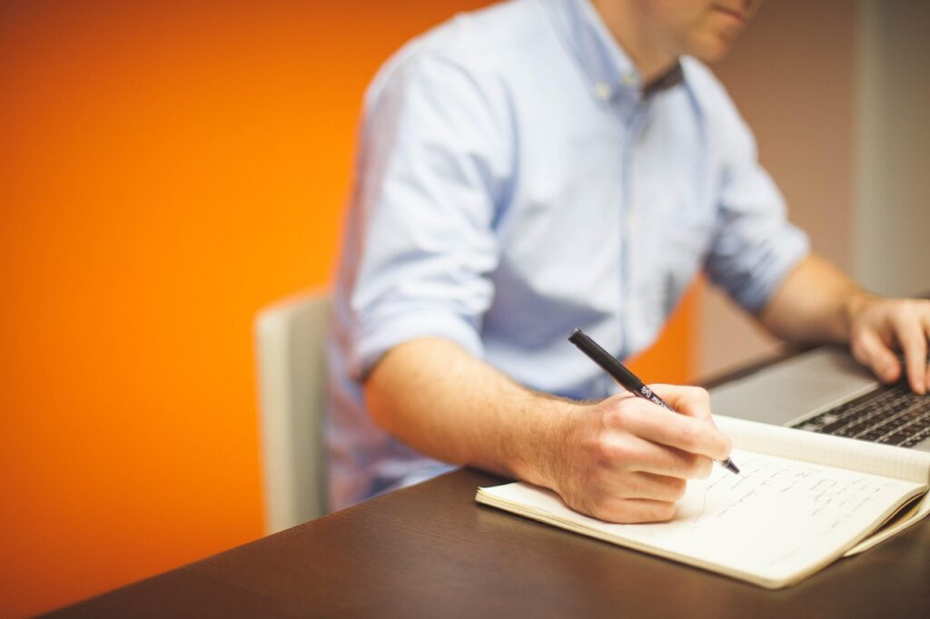 Business owner setting up a new bank account on a laptop