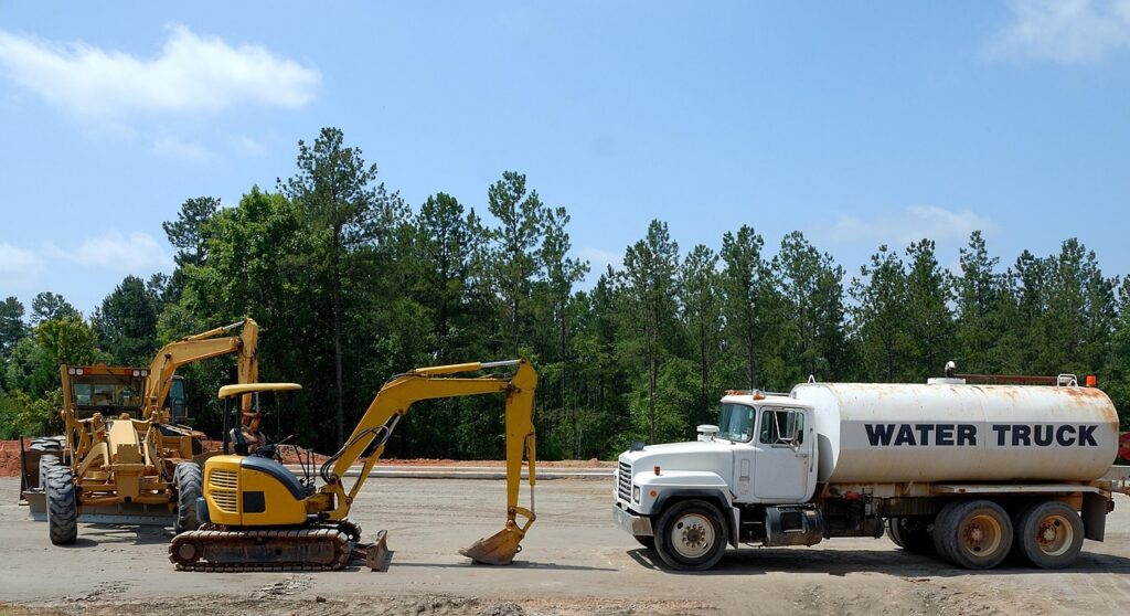Excavation equipment and a loader working at a construction site