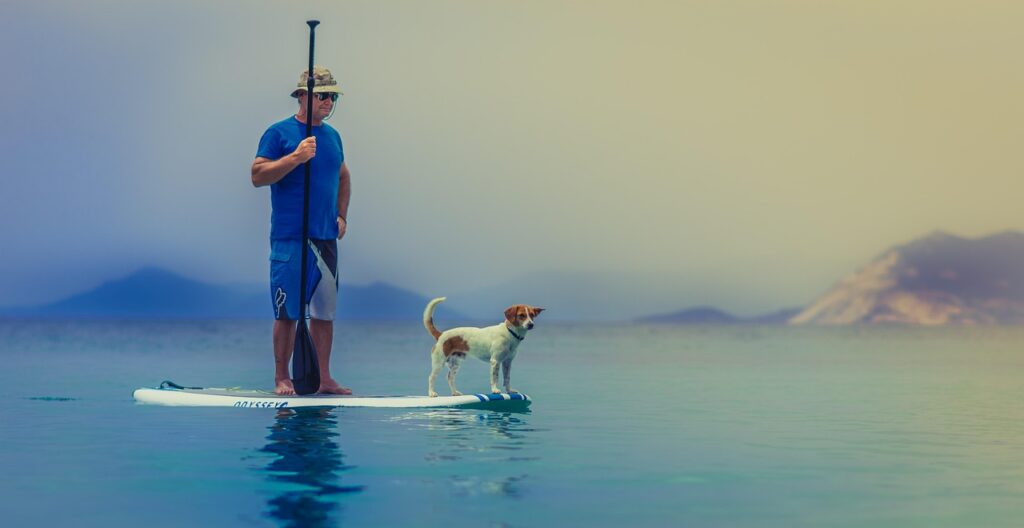 Confident business owner reviewing settlement paperwork with an advisor at a desk