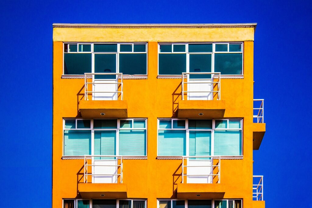 Apartment building exterior with a for rent sign posted