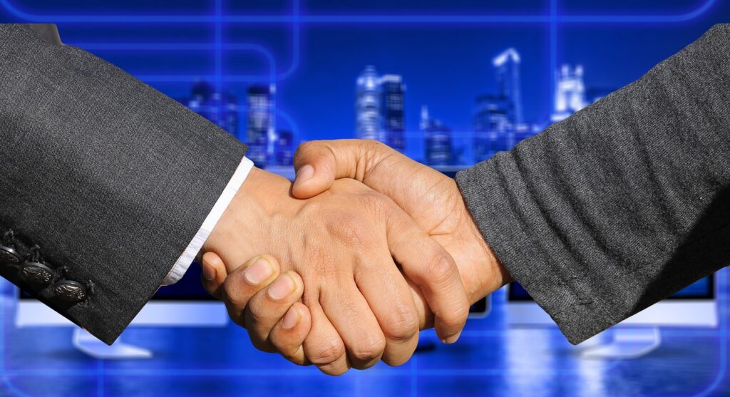 Business owner shaking hands with an advisor after a successful negotiation