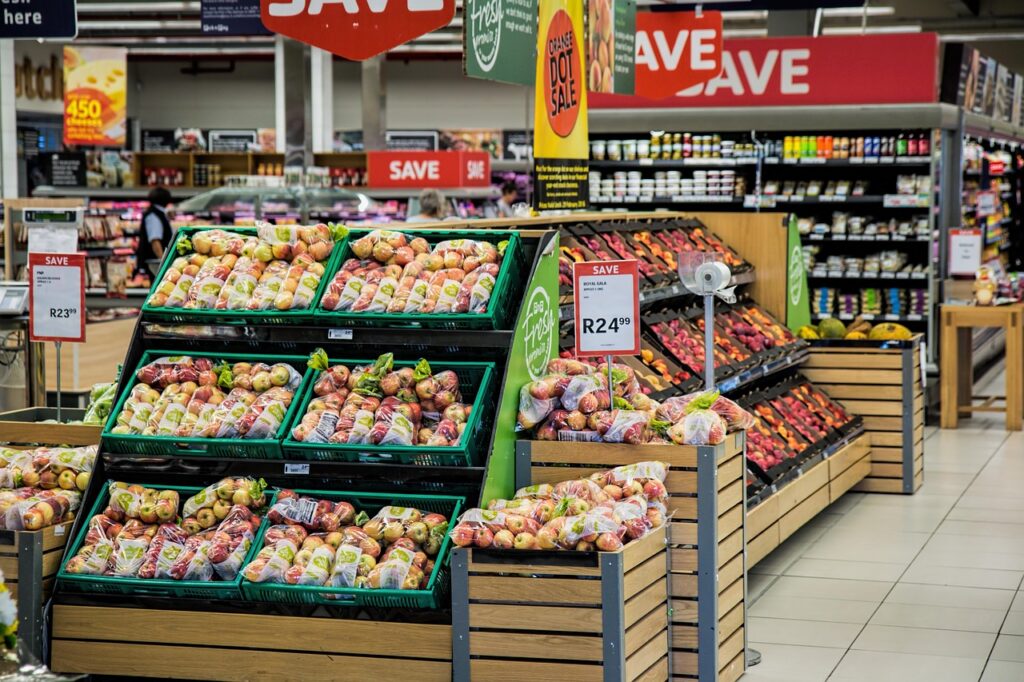 Retail warehouse workers stocking holiday inventory shelves