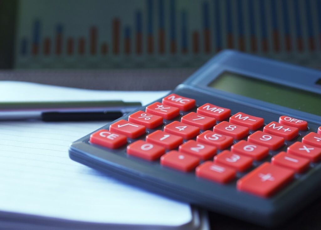 Business owner reviewing a payoff offer letter with a calculator on the desk