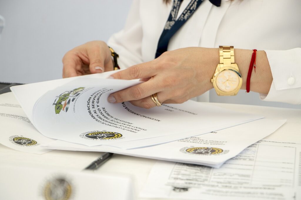 Contractor reviewing invoices and financial paperwork
