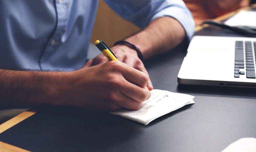 Small business owner in a discussion with a financial advisor about MCA forbearance options