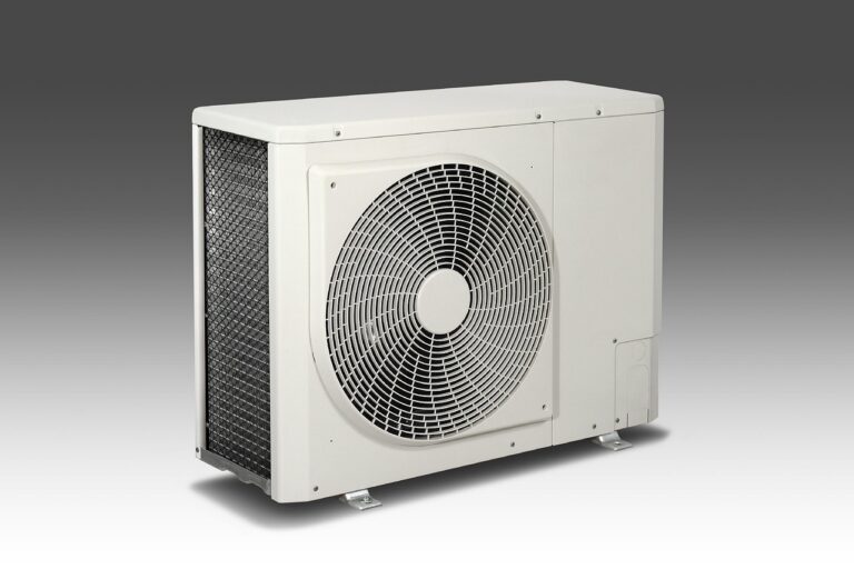 HVAC technician servicing a rooftop air conditioning unit during peak summer season