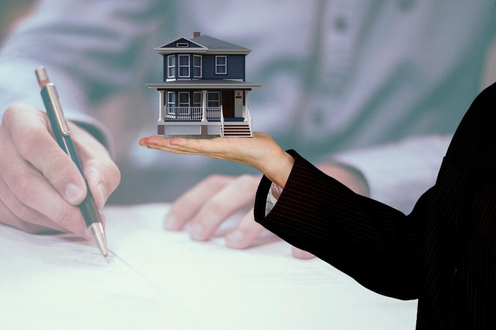 Property manager reviewing rent ledgers and bank statements at a desk