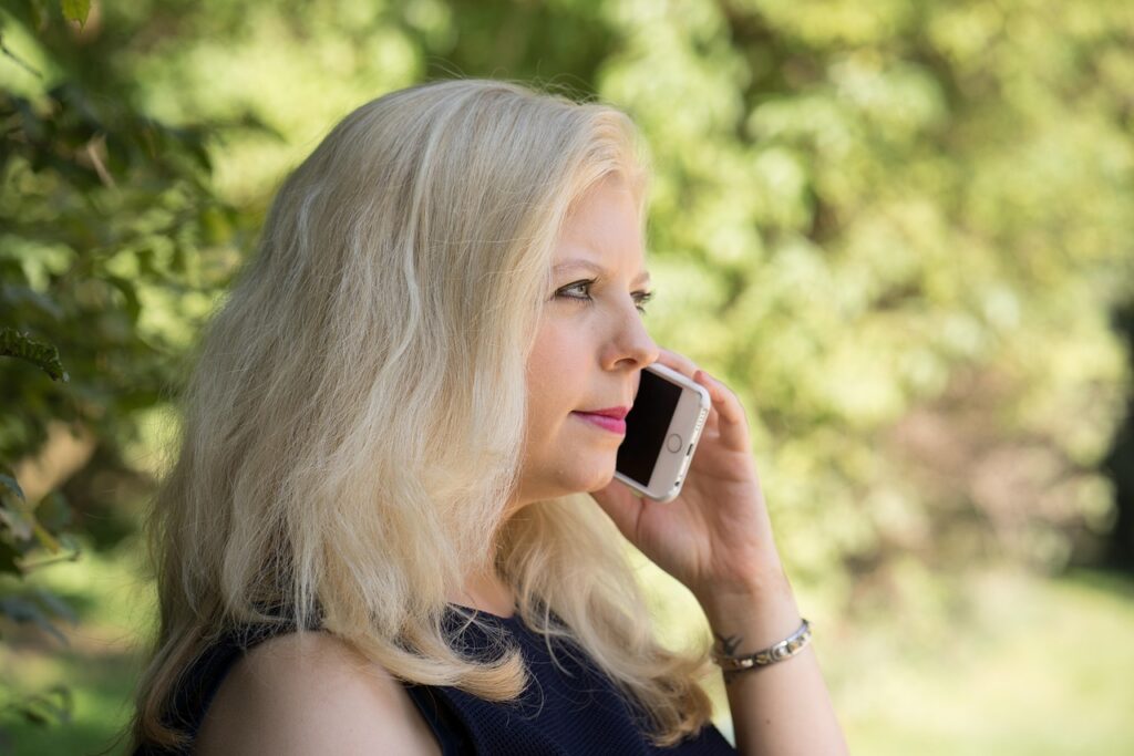 Studio owner on a phone consultation about MCA debt relief options