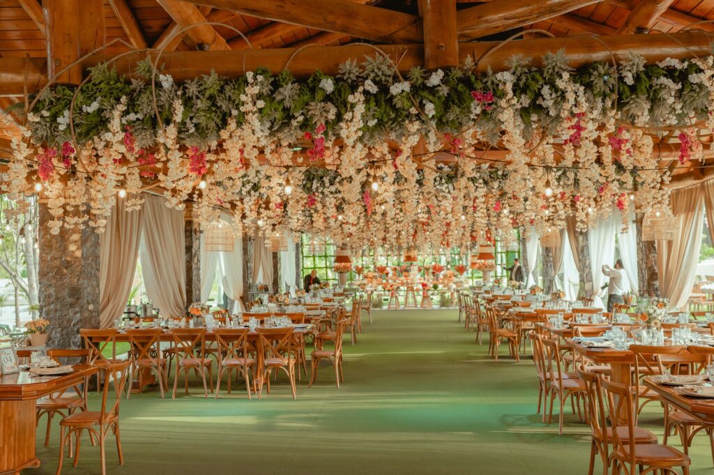 Confident wedding venue owner standing in a decorated event space