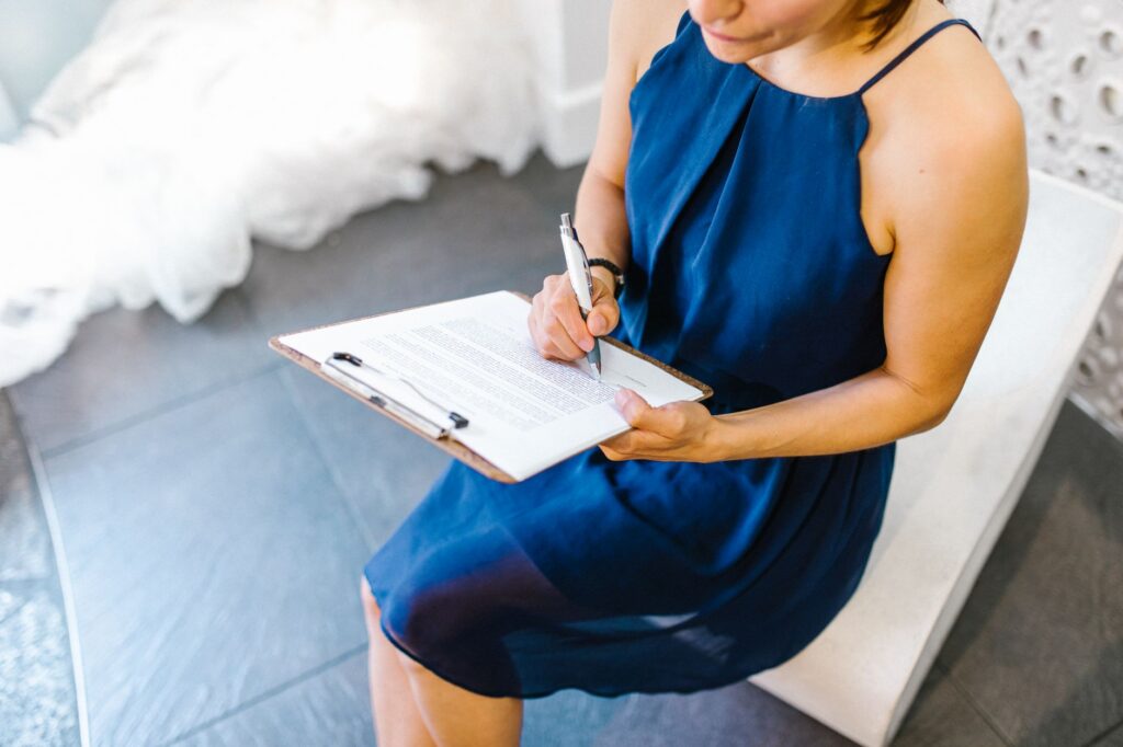 Wedding venue owner reviewing a booking calendar and event contracts
