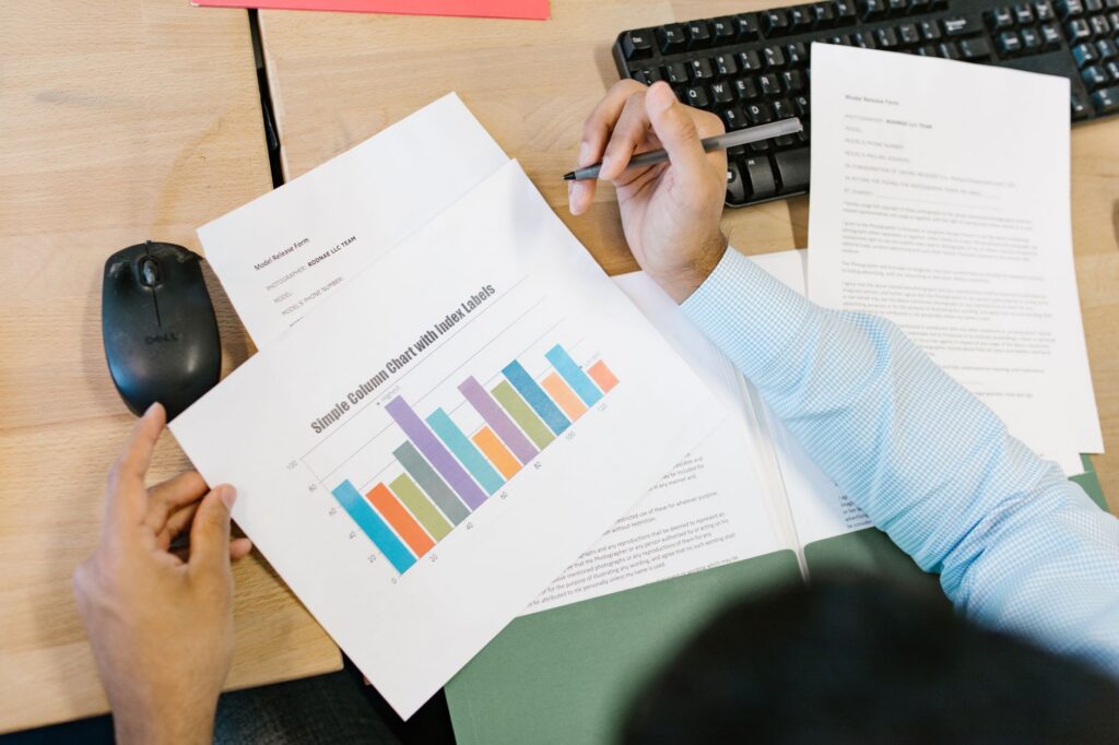 Venue owner reviewing a financial spreadsheet showing upcoming event bookings