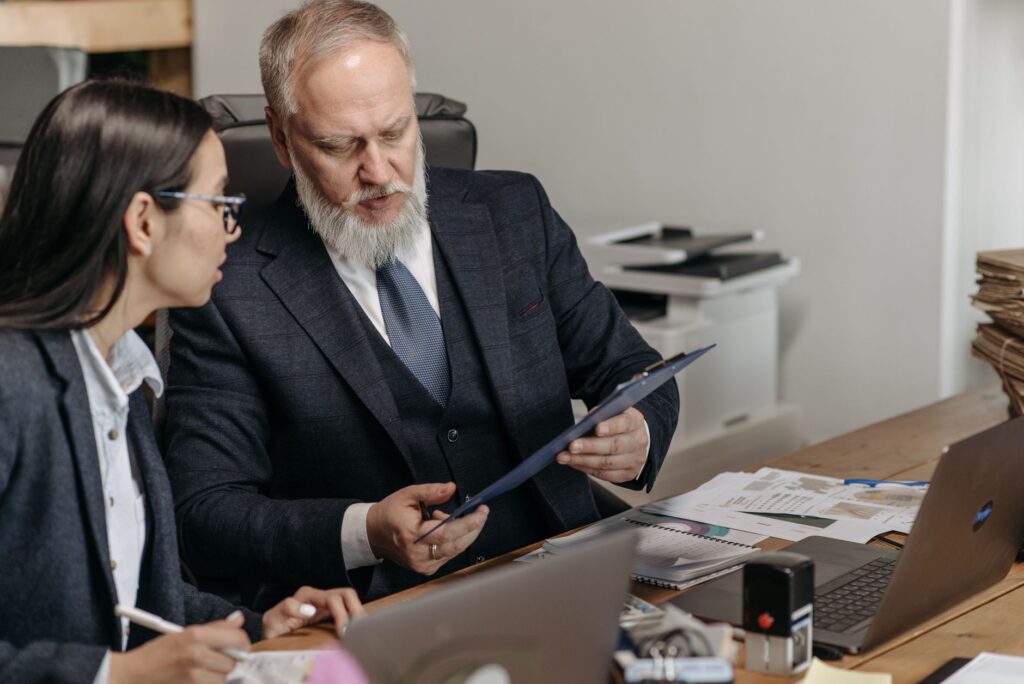 Business owner presenting a rebuilding budget and plan to an advisor
