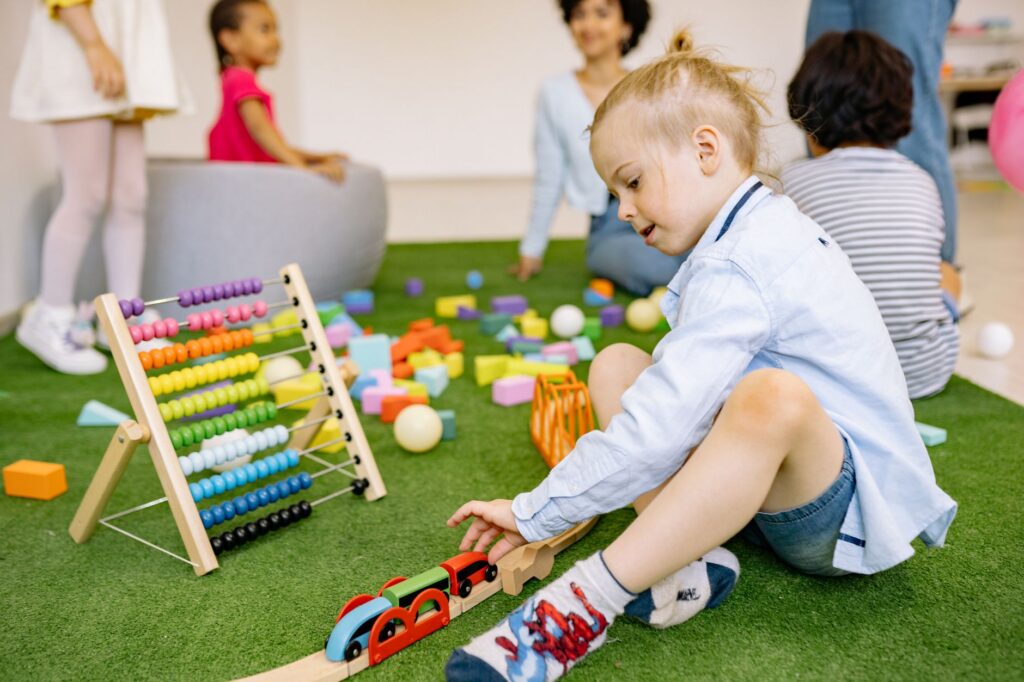Childcare center classroom with toys and small chairs set up for children