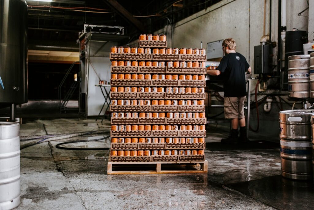 Brewery owner reviewing a fall canning production schedule on a clipboard