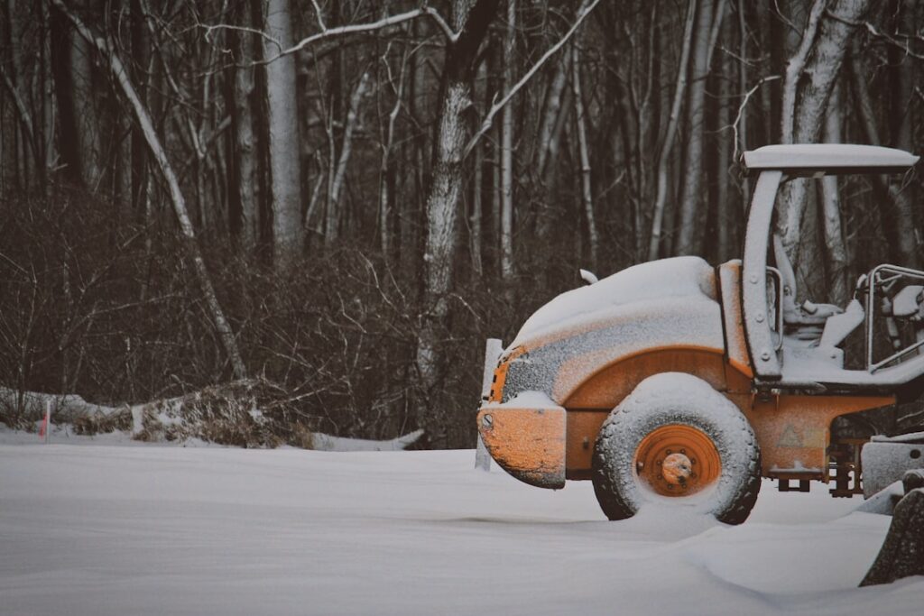 Landscaping equipment parked in an empty yard during the slow winter off-season