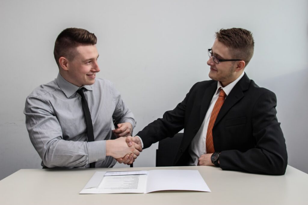MCA debt negotiation meeting with business owner and specialist