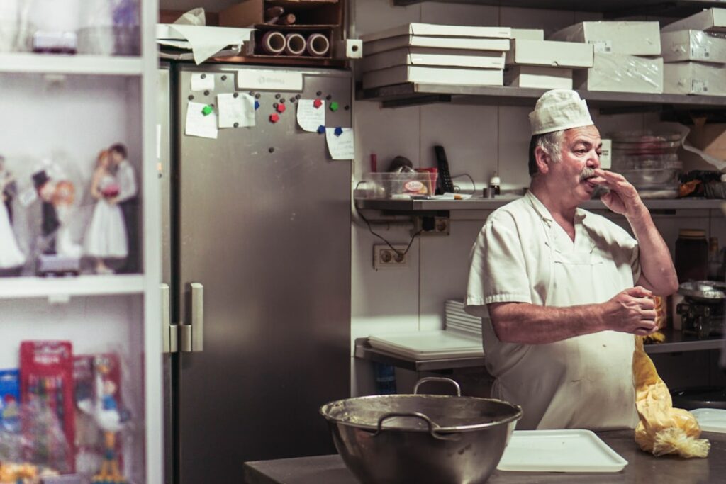 Restaurant kitchen manager checking low inventory on a shelf