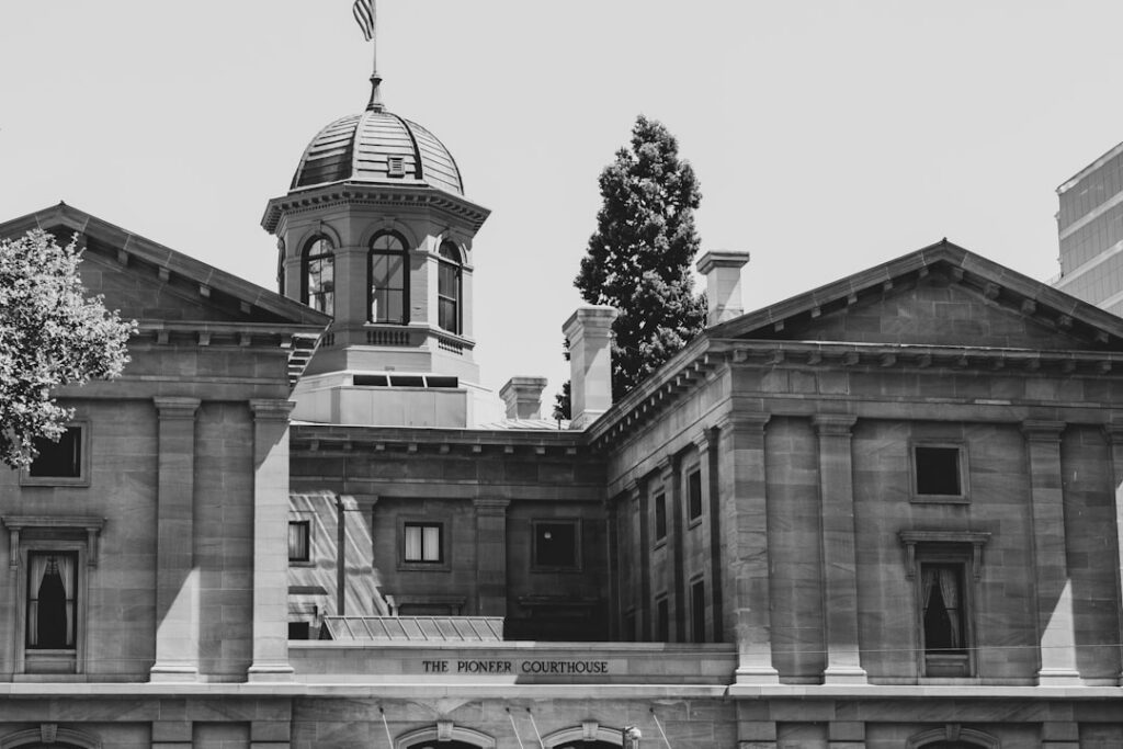 Exterior view of a courthouse building with stone columns