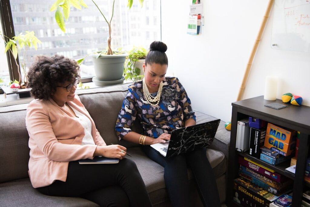 Business owner reviewing a seasonal revenue chart with a financial advisor