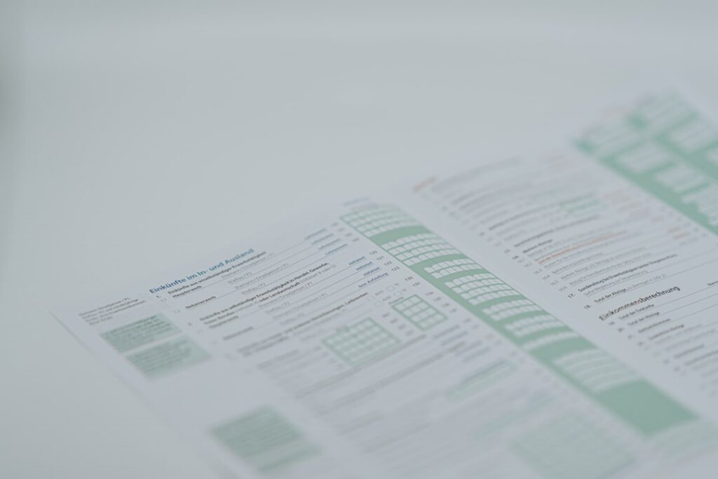 Insurance claim check and policy documents laid out on a desk