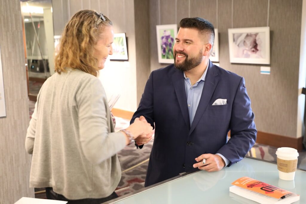 Business owner and financial specialist shaking hands after a negotiation meeting