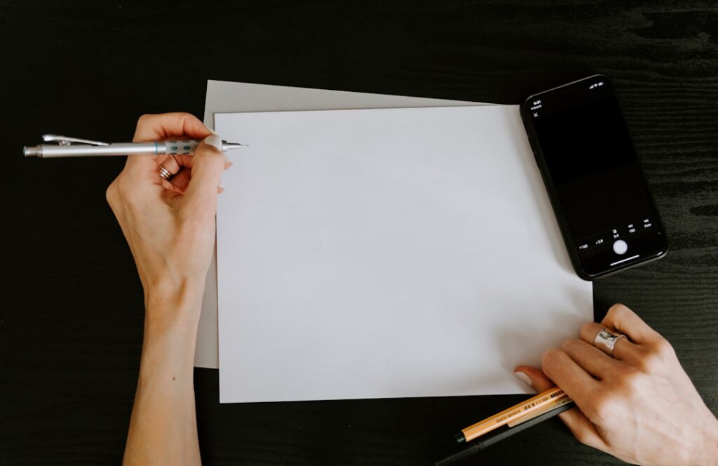 Close-up of hands reviewing a financing contract clause with a pen