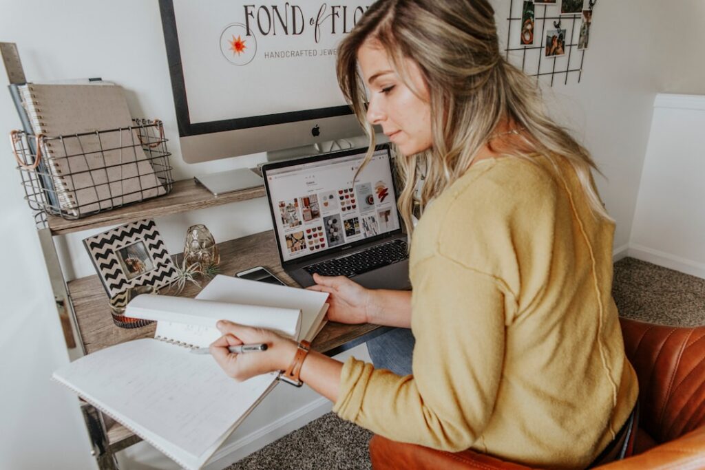 Small business owner reviewing a calendar to plan ahead for the season