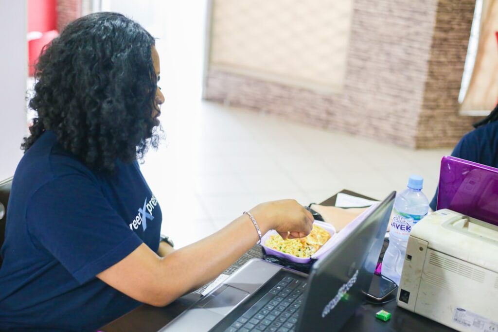 Daycare center owner reviewing licensing paperwork and budget documents