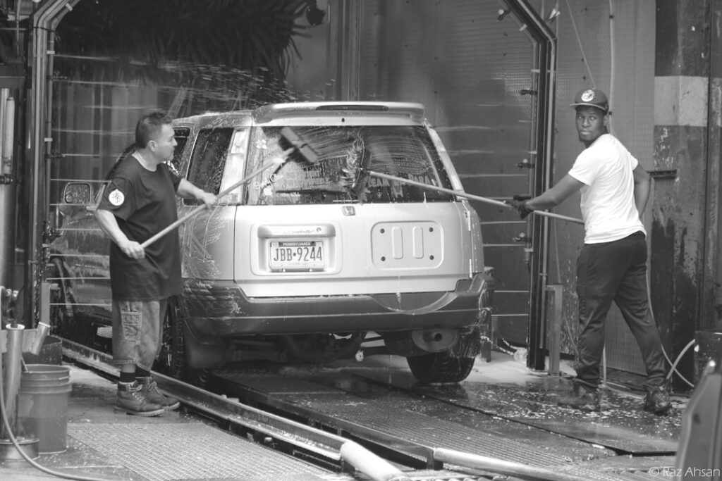 Technician repairing car wash tunnel equipment