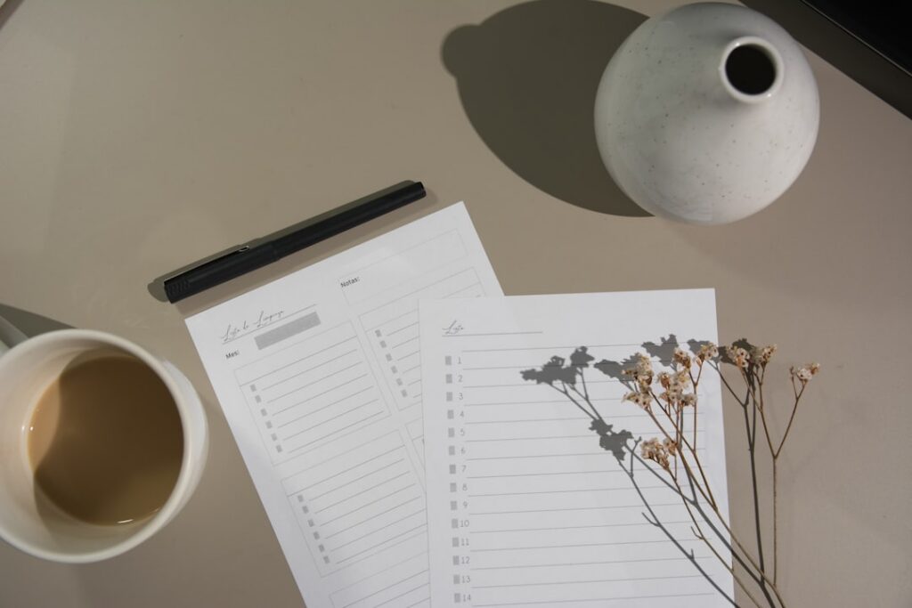 Organized desk with a checklist and financial documents laid out for a settlement plan