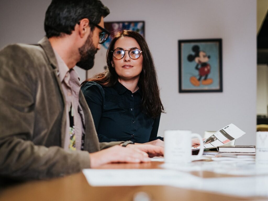 Small business owner reviewing and signing financing contract paperwork