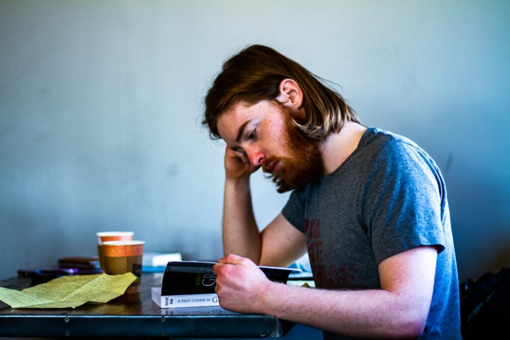 Business owner checking a calendar while reviewing paperwork