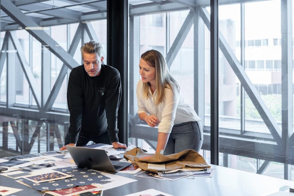 Business owner and advisor reviewing settlement documents together