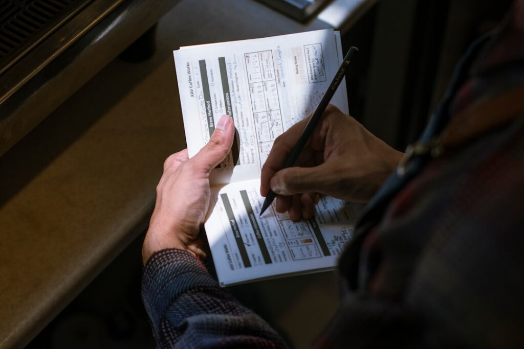 Contractor reviewing a lien waiver document with a pen in hand