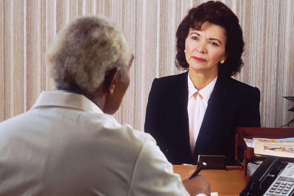 Attorney reviewing court filing documents with a small business client