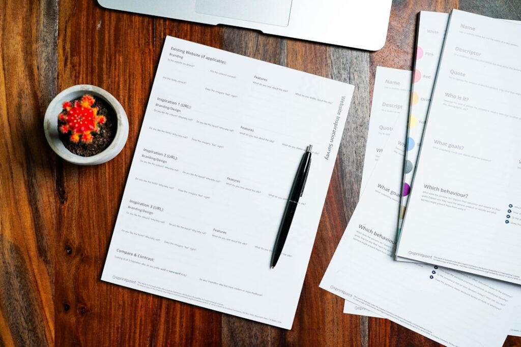 Stack of loan and contract documents representing stacked debt
