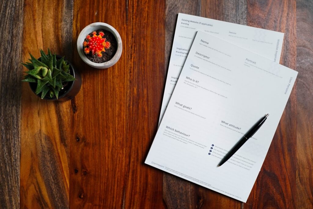 Stack of overdue invoices and financing contracts on a desk