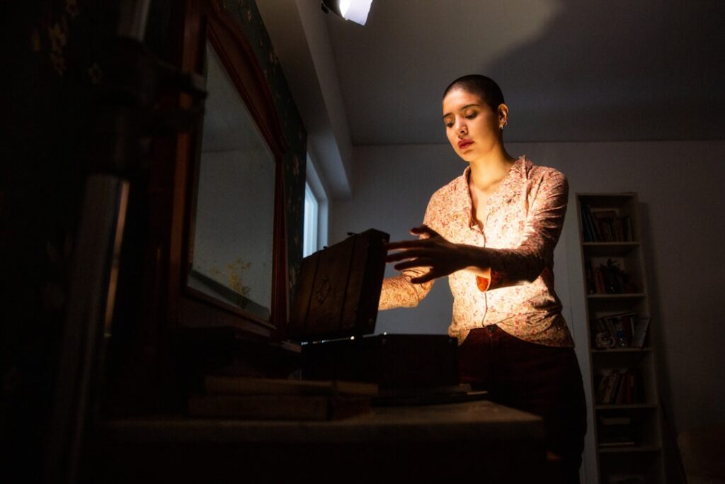 Business owner searching for MCA debt relief options on a laptop at night