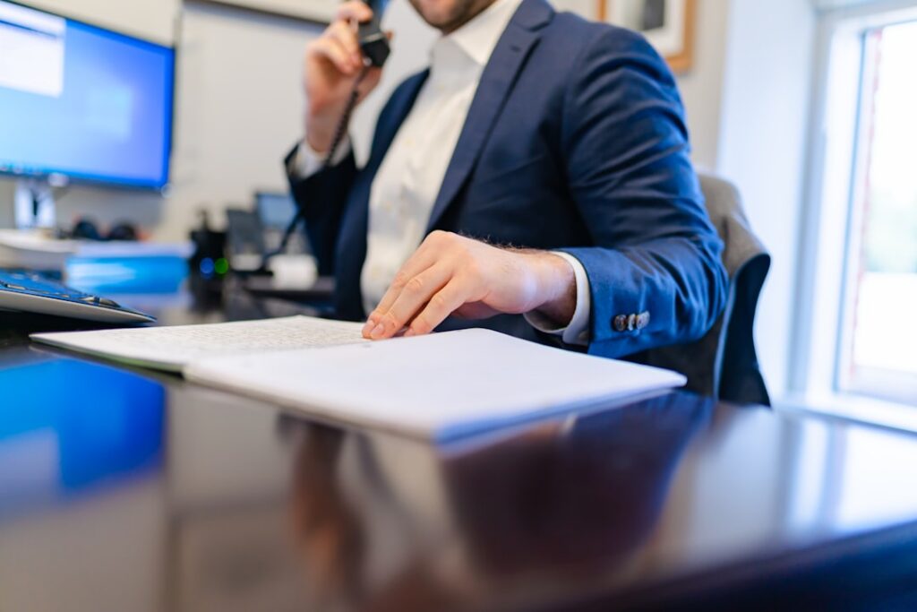 Business owner reviewing an old merchant cash advance contract at a desk