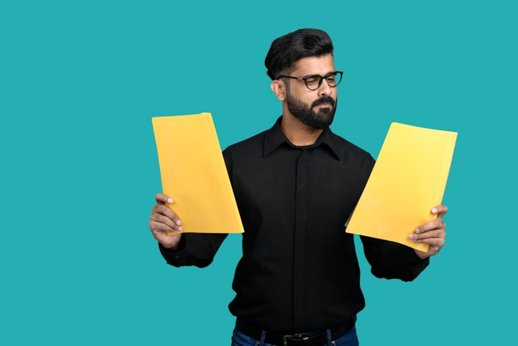 Small business owner reading a court document with a concerned expression at a desk