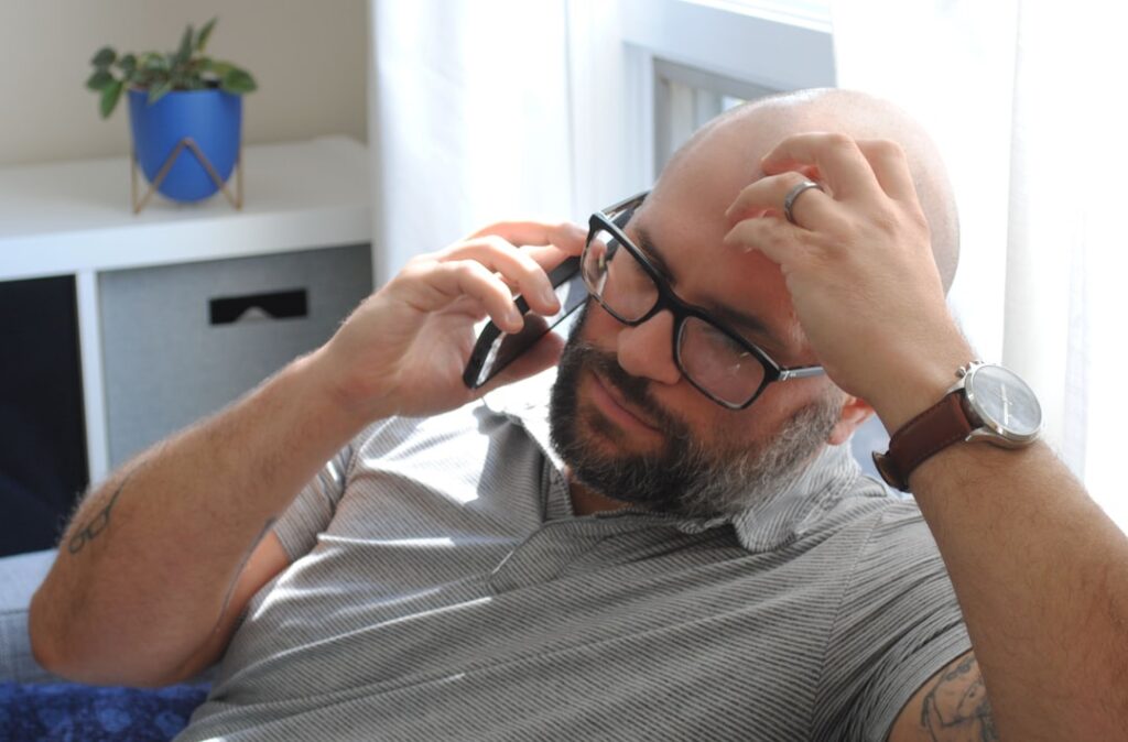 Business owner on the phone looking frustrated during a high-pressure sales call