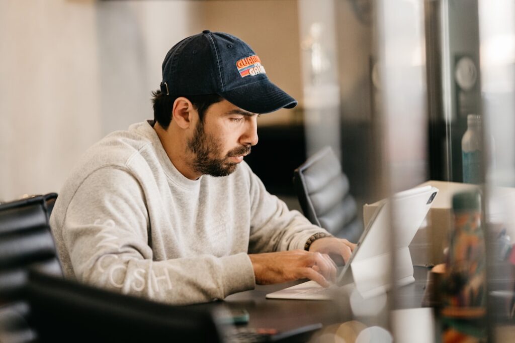Business owner carefully checking wire transfer instructions on a computer screen